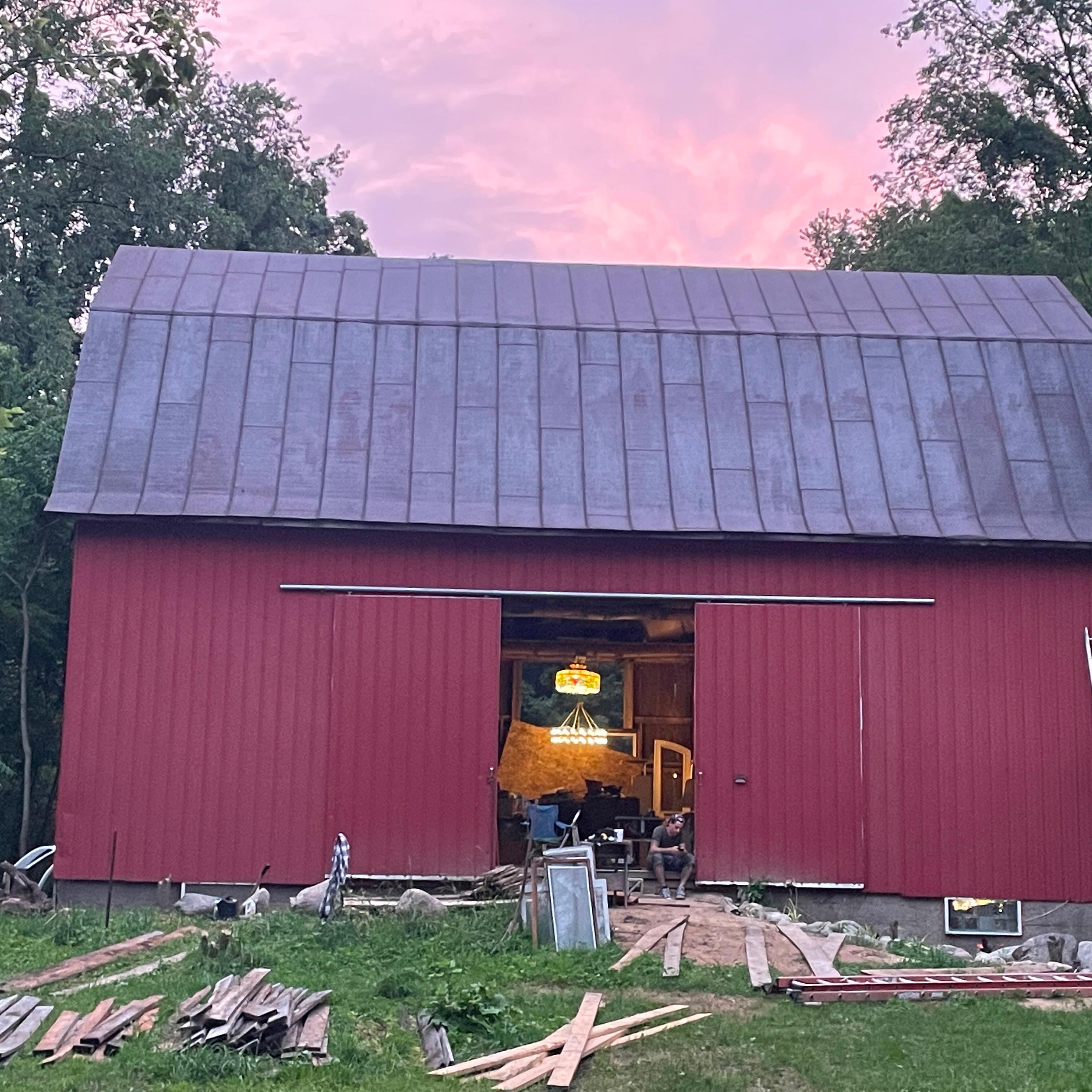 The Stanton Farm barn at dusk, mid-restoration